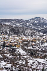 Vertical View of the town of Terranova di Pollino in Winter, Covered with Snow.