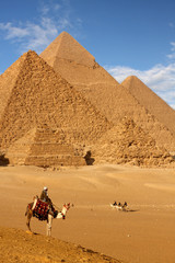 pyramids giza cairo in egypt with camel caravane panoramic scenic view