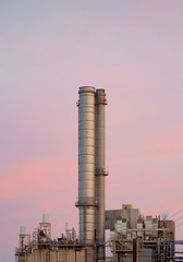 Industrial Chimneys and Pipes in a pink sky