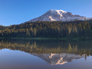 Fototapeta na wymiar calm summer morning view of mt rainier and reflection lake in washington state of the us pacific northwest