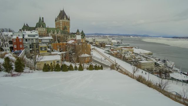 Scenic urban timelapse of Frontenac castle on bank of Saint Lawrence river in Quebec province in Quebec-CIty in Canada. Beautiful view of old historic building in city center of capital of province.