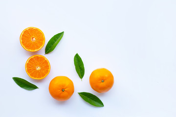High vitamin C,  Fresh orange citrus fruit with green leaves on white background.