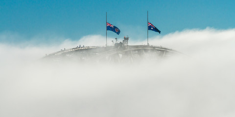 Bridge & Fog - The Sydney Harbour Bridge just peeks above the morning fog. Sydney, New South Wales, Australia