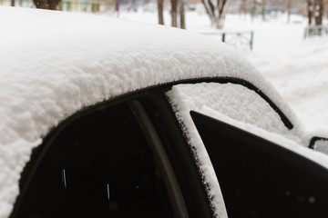 Transportation, people, season and ownership concept - close up of  unlocking frozen car door lock....