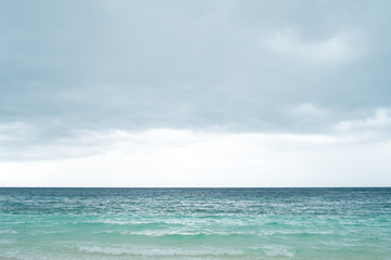 Fototapeta na wymiar Empty sea, beach and cloudy sky