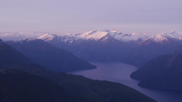 British Columbia, Canada circa-2018. Aerial view of snow covered mountain range.  Shot from helicopter with Cineflex gimbal and RED Epic-W camera.