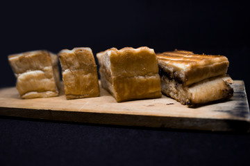 toast with chocolate sprinkles and tea to accompany relaxing time with a black background