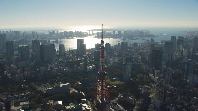 Tokyo, Japan circa-2018.  Flying over city of Tokyo and Tokyo Tower.  Shot from helicopter with RED camera.