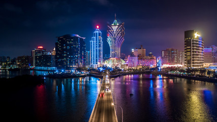 Macau cityscape at night, all hotel and tower are colorful lighten up with blue sky, Macau, China.