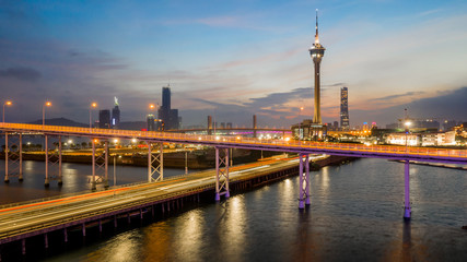 Macau city skyline at sunset with Macau Tower in twilight, Aerial view,  Macau, China.