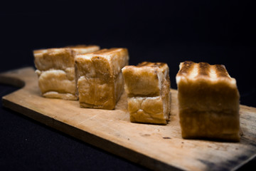 toast with chocolate sprinkles and tea to accompany relaxing time with a black background