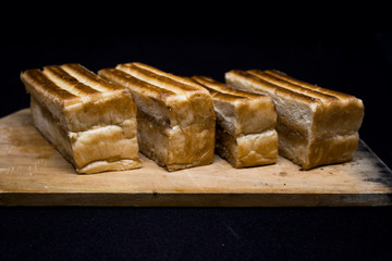 toast with chocolate sprinkles and tea to accompany relaxing time with a black background