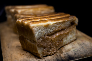 toast with chocolate sprinkles and tea to accompany relaxing time with a black background