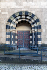 Church door with metal decoration