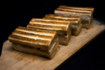 toast with chocolate sprinkles and tea to accompany relaxing time with a black background