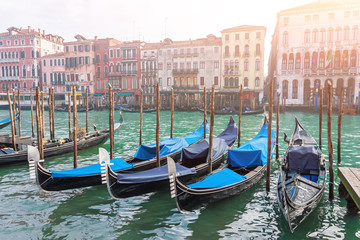 Fototapeta na wymiar Canal with gondolas on the pier Venice, Italy. Architecture and landmarks of Venice