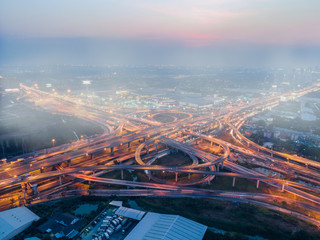 aerial top view of express way in rush hours traffic creat in far area of smog and dust by cars...