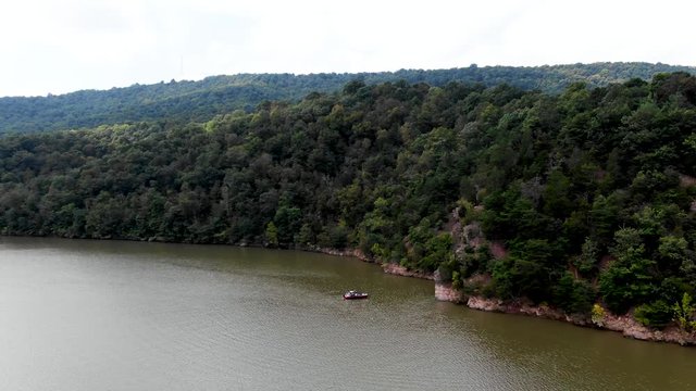 Stunning cliffs on the shores of Raystown lake in Pennsylvania. The area offers many outdoor recreational activities, motorboating and watersports like wakeboarding and fishing