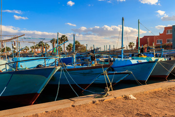 Old fishing boats in the sea harbor of Hurghada, Egypt