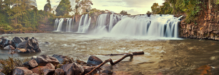 Beautiful waterfall in the tropical jungles panoramic sunset view