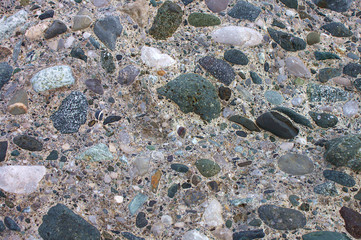 Small stones in a concrete wall