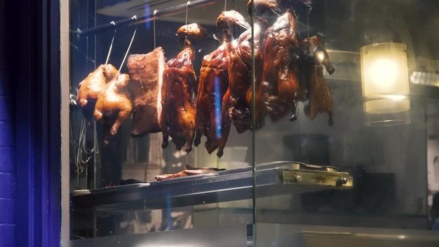 Night Chinatown London Soho district restaurant window peking roast duck.