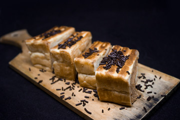 toast with chocolate sprinkles and tea to accompany relaxing time with a black background