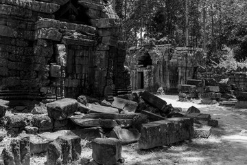 Mono fallen stone blocks litter temple grounds
