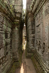 Naklejka premium Narrow passage between leaning walls of temple