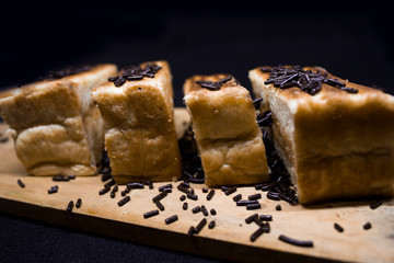 toast with chocolate sprinkles and tea to accompany relaxing time with a black background
