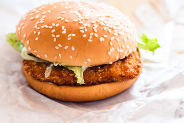 chicken fried burger with fresh vegetable fast food  on white paper background