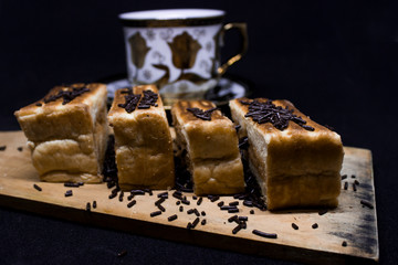toast with chocolate sprinkles and tea to accompany relaxing time with a black background