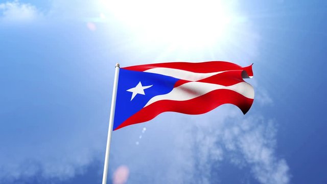 The national flag of Puerto Rico waving in the wind on a sunny day.  Beautiful slow motion shot of the Puerto Rican flag.