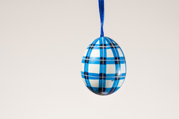 A blue painted easter egg used for decorating an Easter egg tree