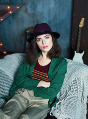 young pretty woman waiting alone in modern loft studio, fashion 