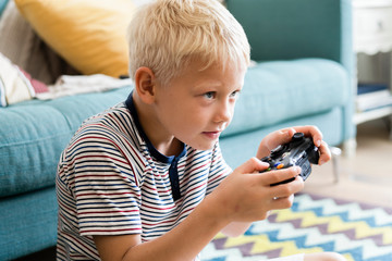 Little boy playing video games