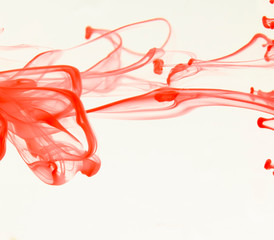 Color drop in water on a white background close-up, abstraction