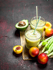 Smoothie with peaches, avocado and celery.