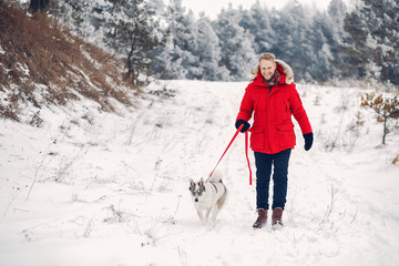 Beautiful woman playing with a dog