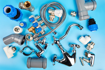 plumbing tools and equipment on blue background top view.