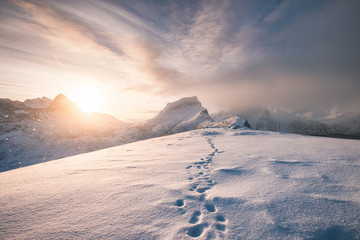 Snowy mountain ridge with footprint in blizzard - Powered by Adobe