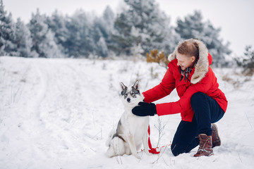 Beautiful woman playing with a dog