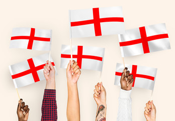 Hands waving the flags of English