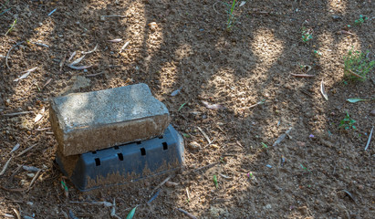 A temporary plastic cover with a brick on top to weigh it down image with copy space in landscape...
