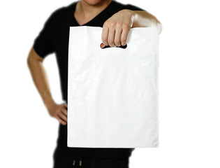 A man holding a white plastic bag. Close up. Isolated on white background