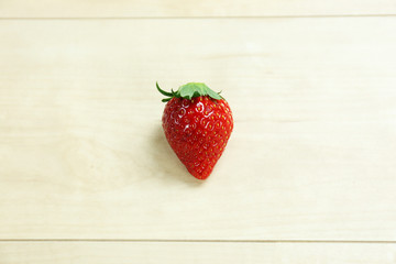 fresh isolated strawberry on the table