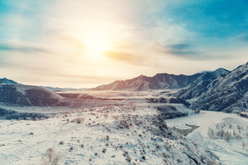 Winter snow river in mountains. Snow winter mountain river valley landscape. Winter snow river in winter snow mountain valley