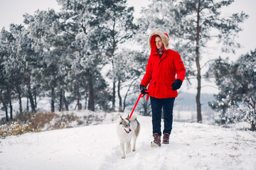 Beautiful woman playing with a dog