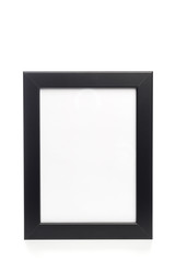 Obraz premium black photo frame isolated on white background.