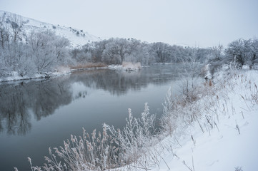 Winter landscape with river